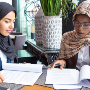 confident-female-professionals-checking-documents